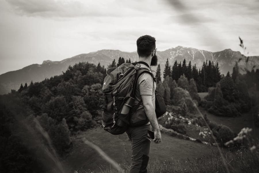 A squared-off travel backpack standing upright