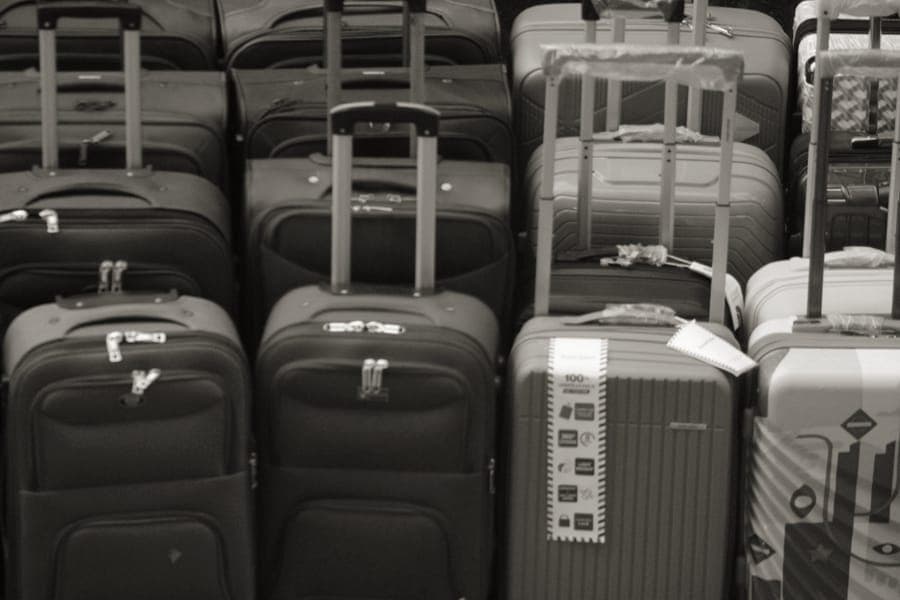 A softside cabin suitcase with an extended telescoping handle