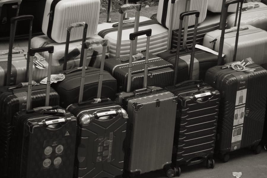A large hardside checked suitcase with spinner wheels