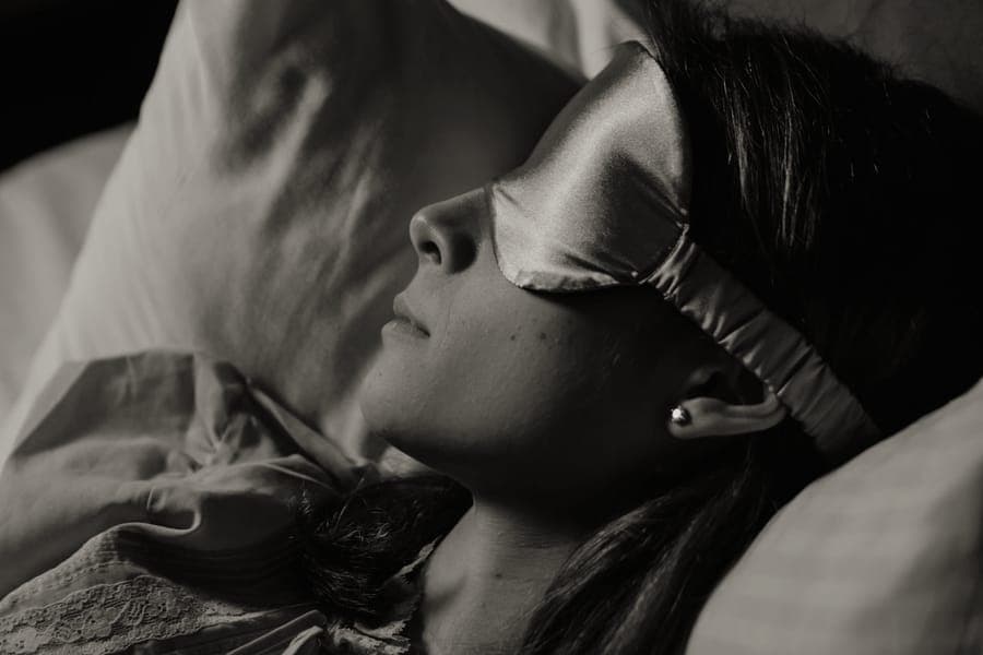 A contoured travel eye mask and earplugs