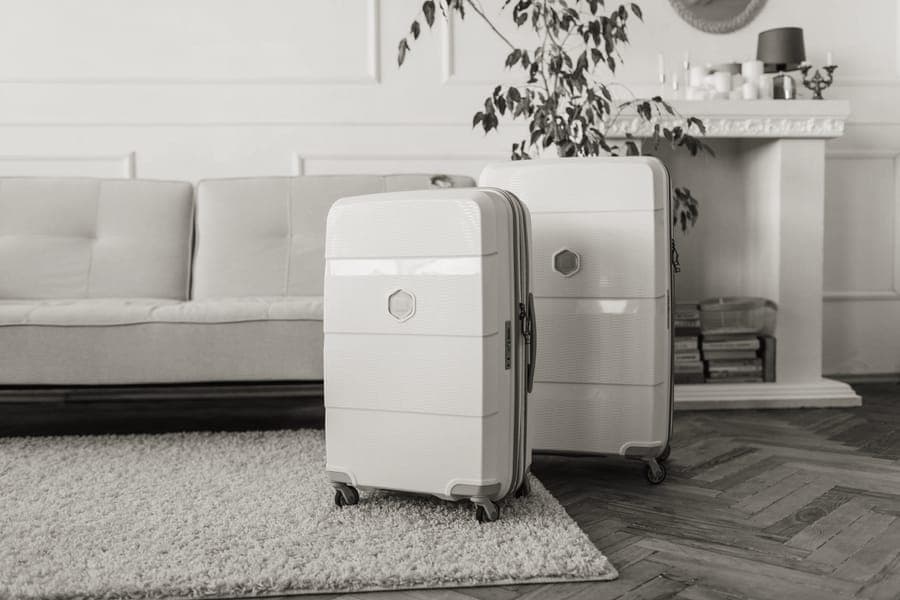 Three matching hardside suitcases in descending sizes