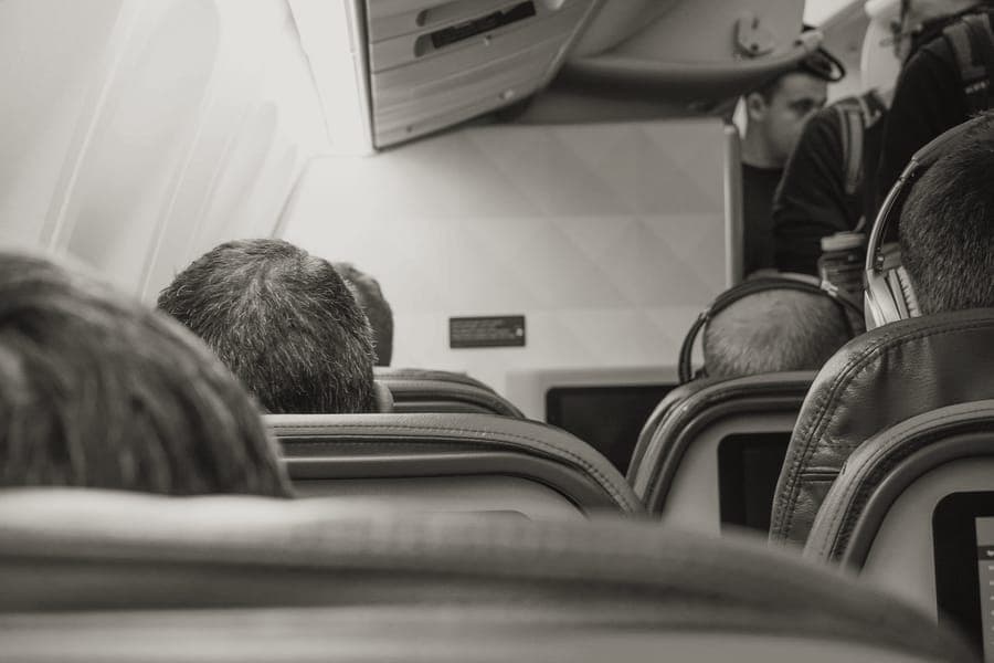 A travel pillow resting on an aircraft seat