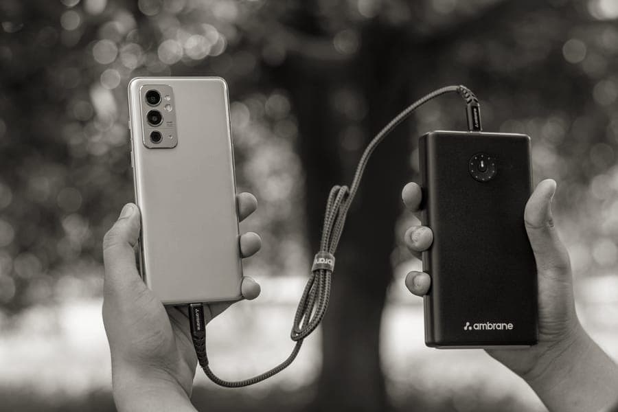 A phone being charged from a handheld power bank