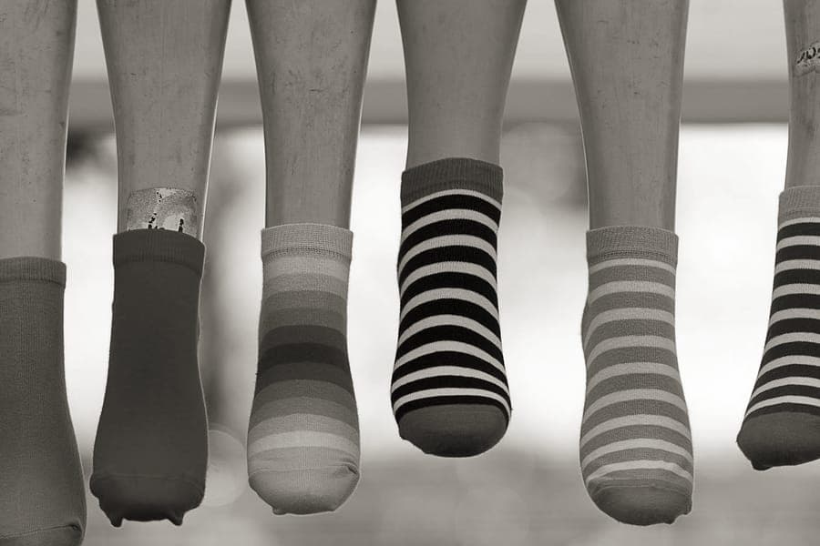Compression socks laid out beside travel items