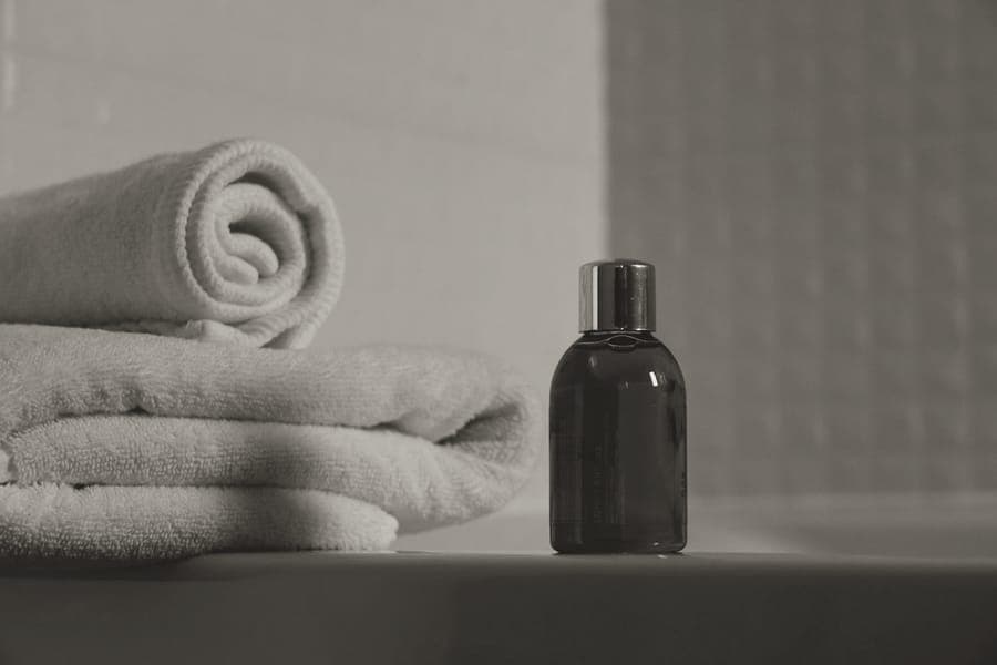 A zipped travel toiletry bag with a hanging hook