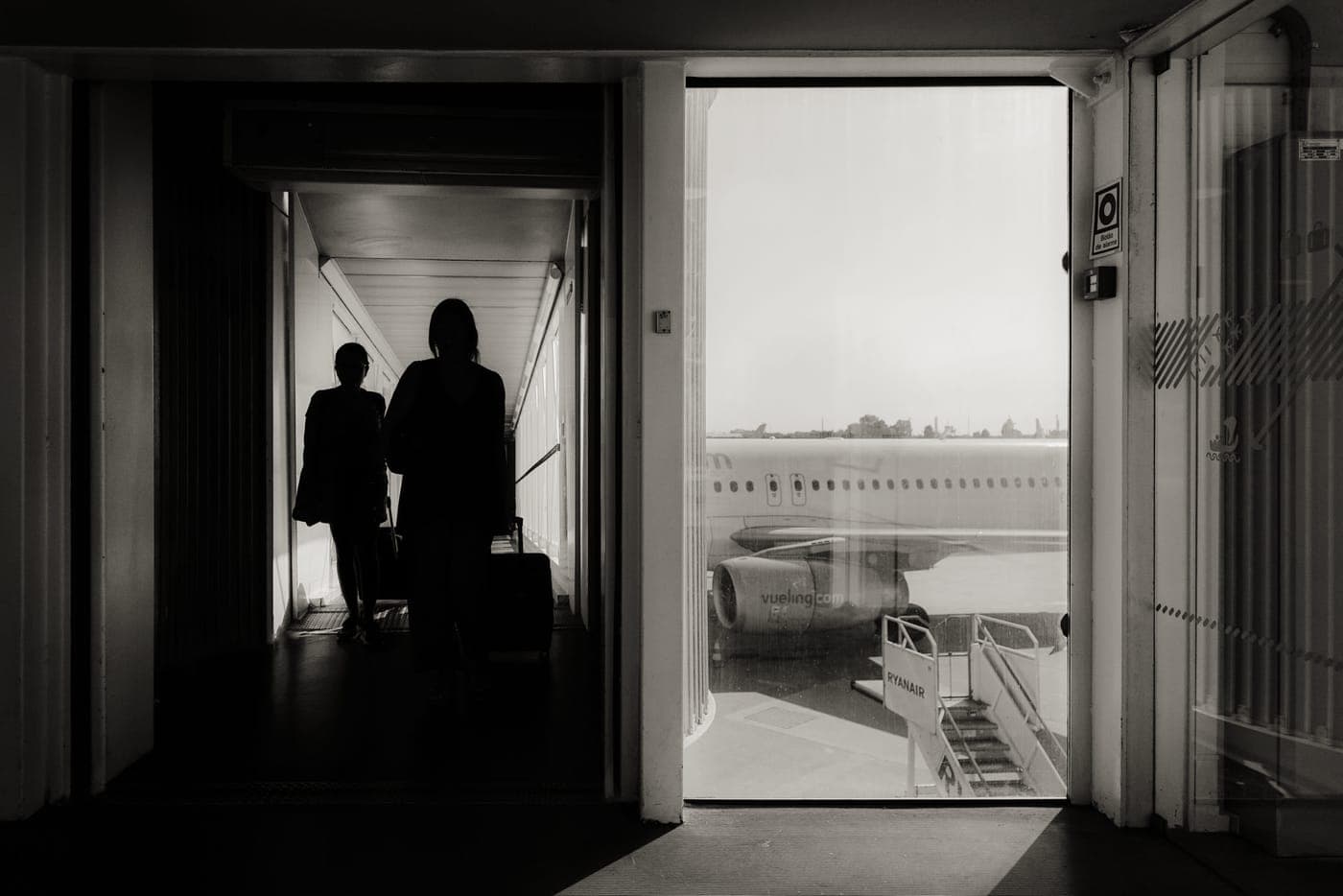 An international departures hall with travelers and luggage