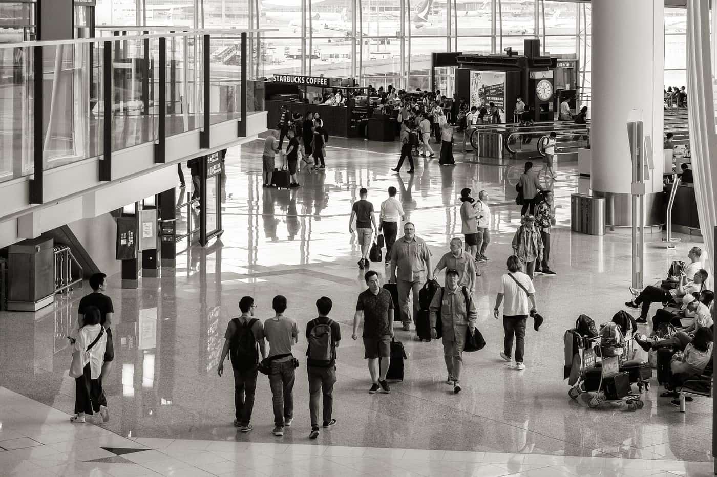 A range of suitcases and travel bags in an airport setting