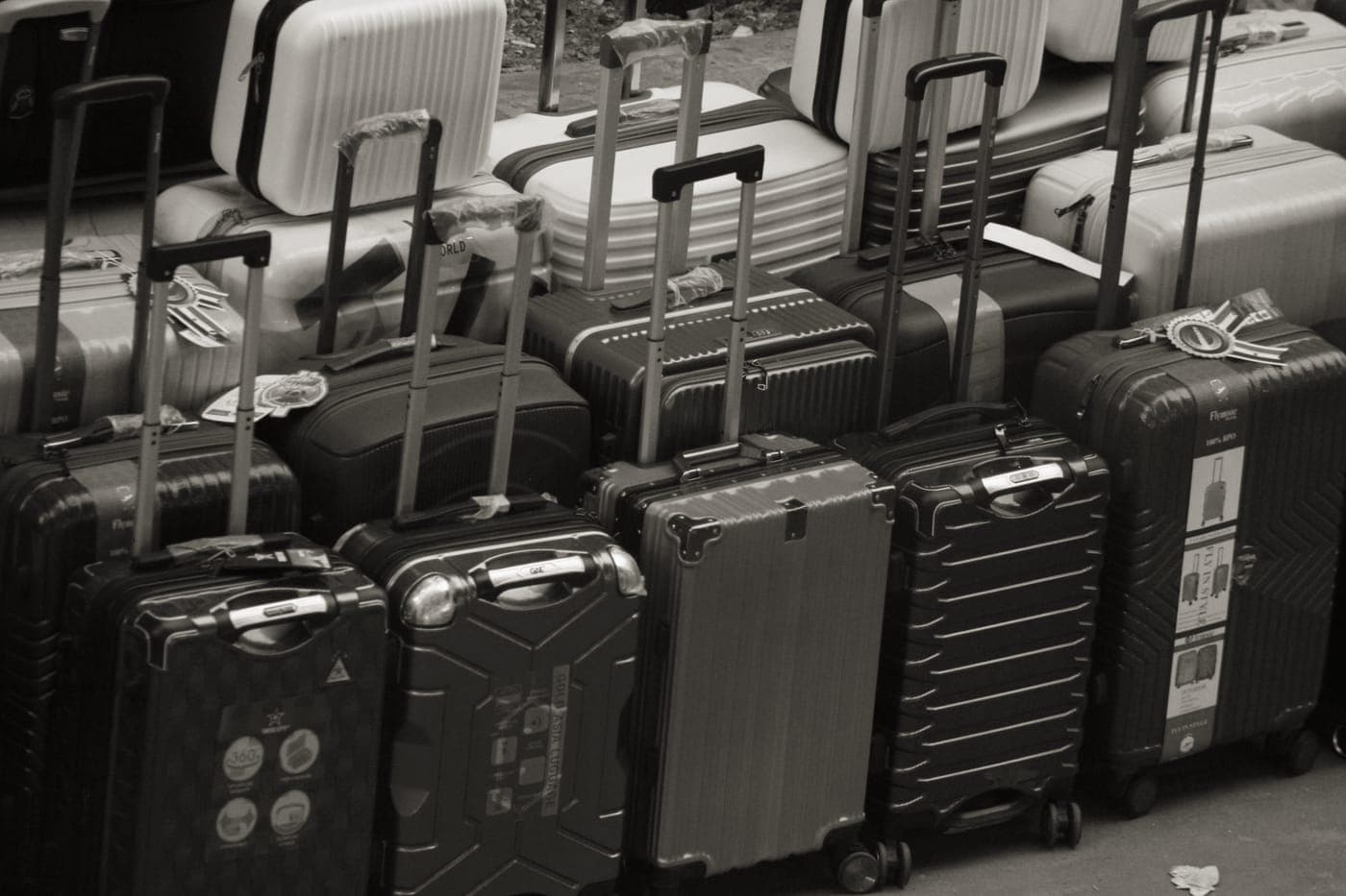 Hardside suitcases on an airport baggage carousel