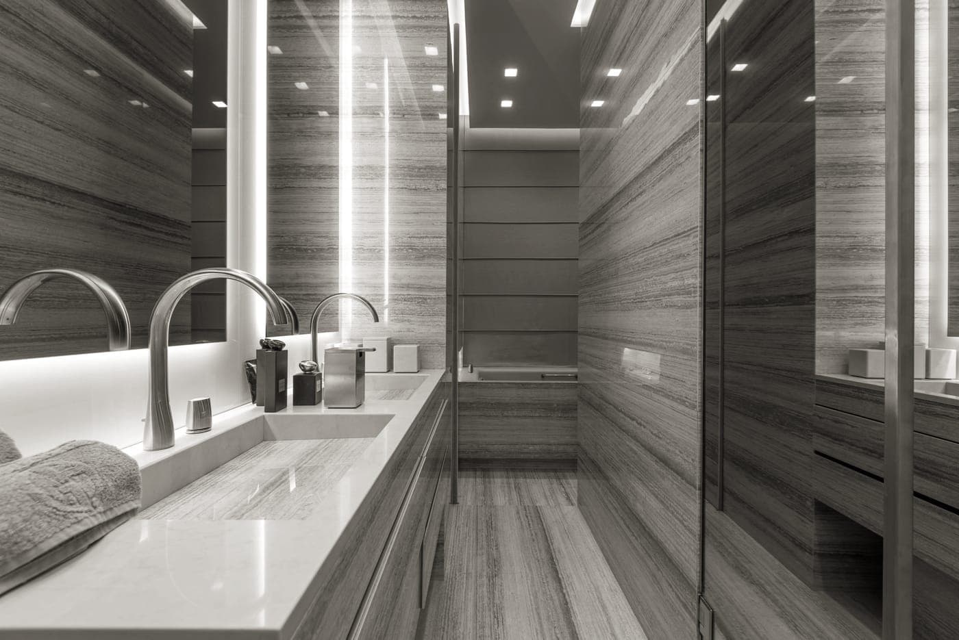 Travel-size toiletries arranged on a bathroom counter