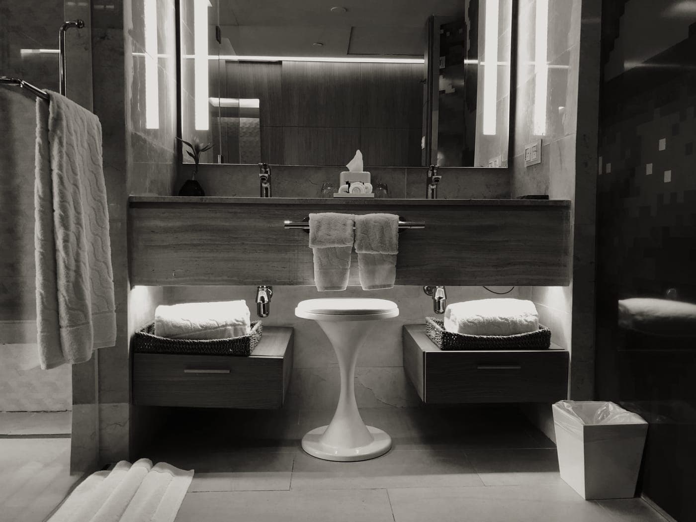 A hanging toiletry bag open on a hotel bathroom door