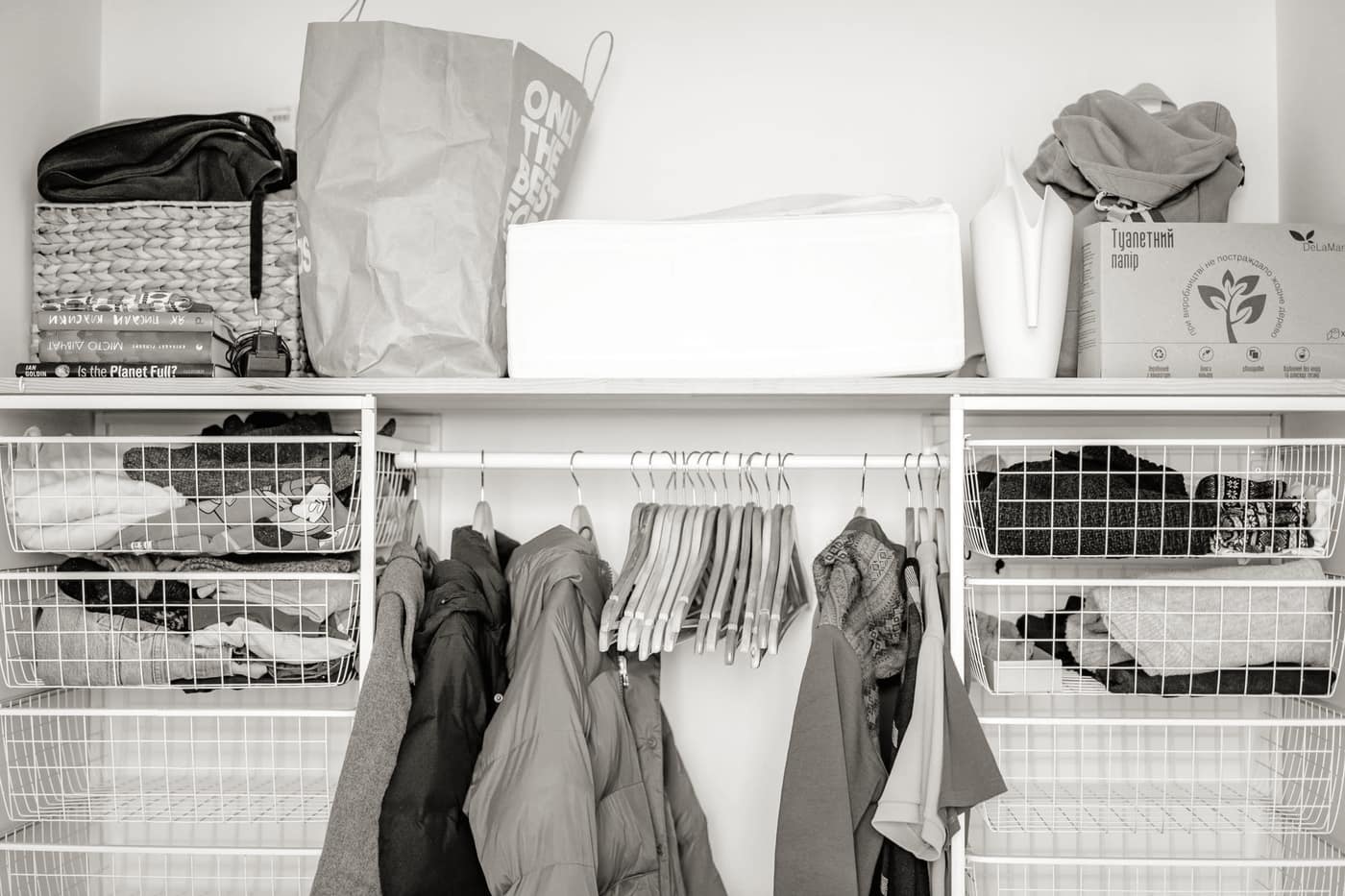 Clothes being folded and sorted beside an open bag