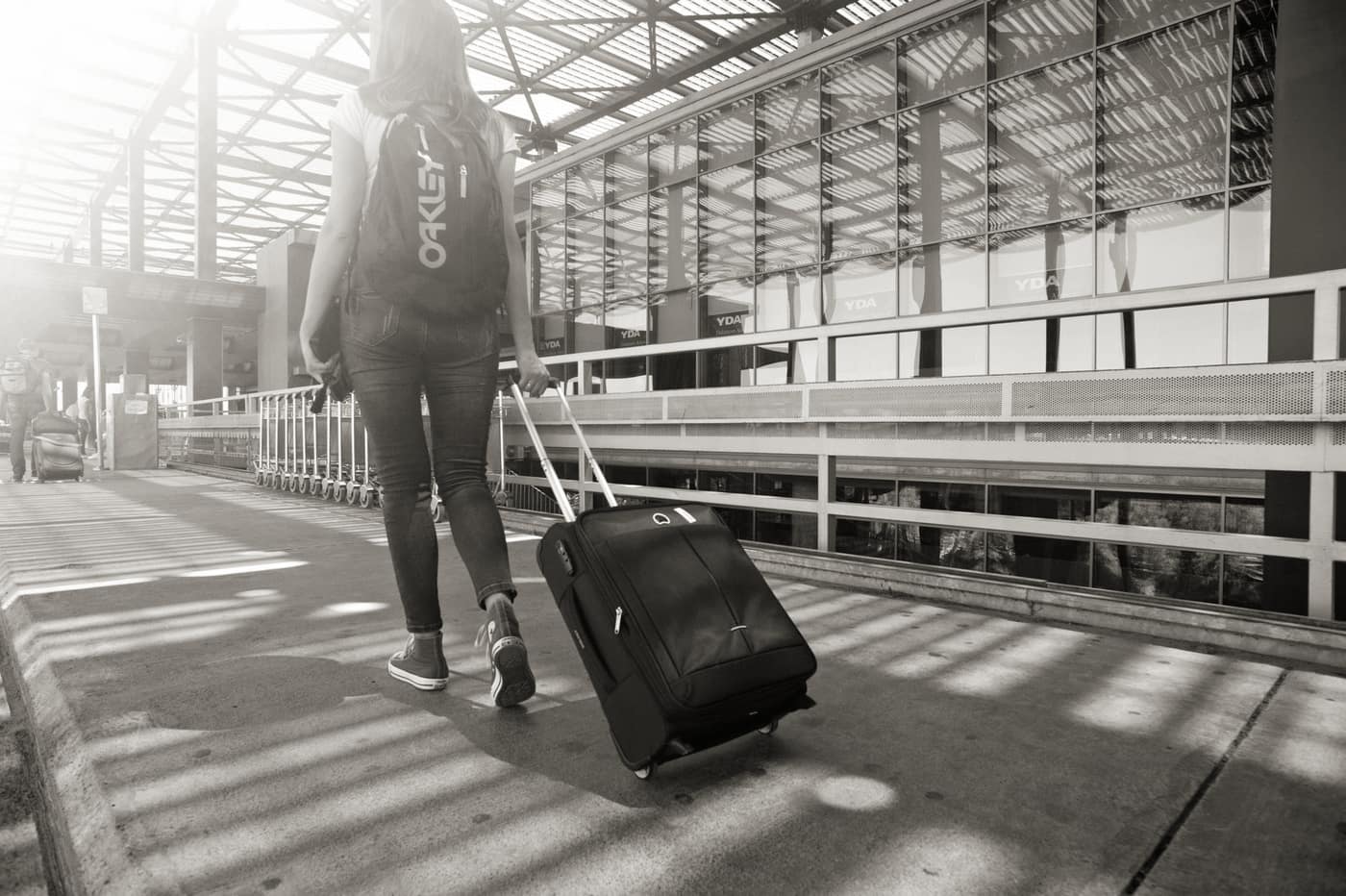 Bags and trays moving through an airport security screening checkpoint