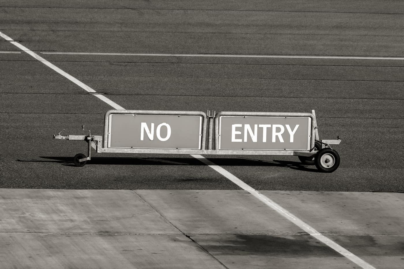 A No Entry barrier standing on an airport apron